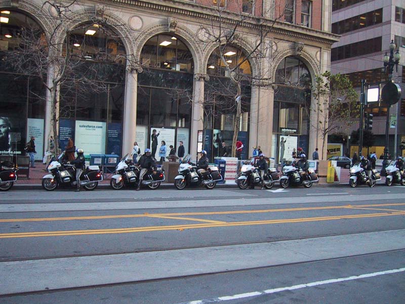Motorcycle Cops line Sidewalk