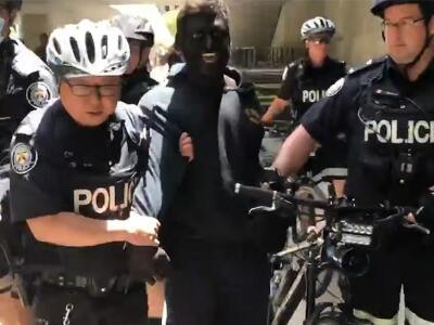 black face man at Toronto BLM protest